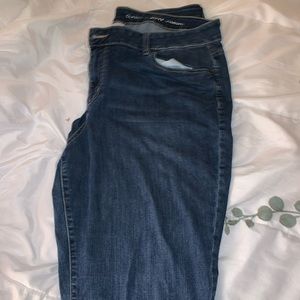 Lightly worn straight jeans.